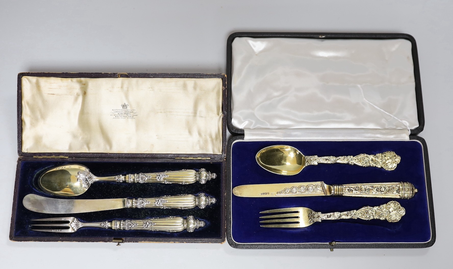 A cased George IV silver gilt christening trio (spoon, knife and fork) by Ely & Fearn, London, 1823 and one other cased Victorian parcel silver gilt trio, Francis Higgins, London, 1848/9.